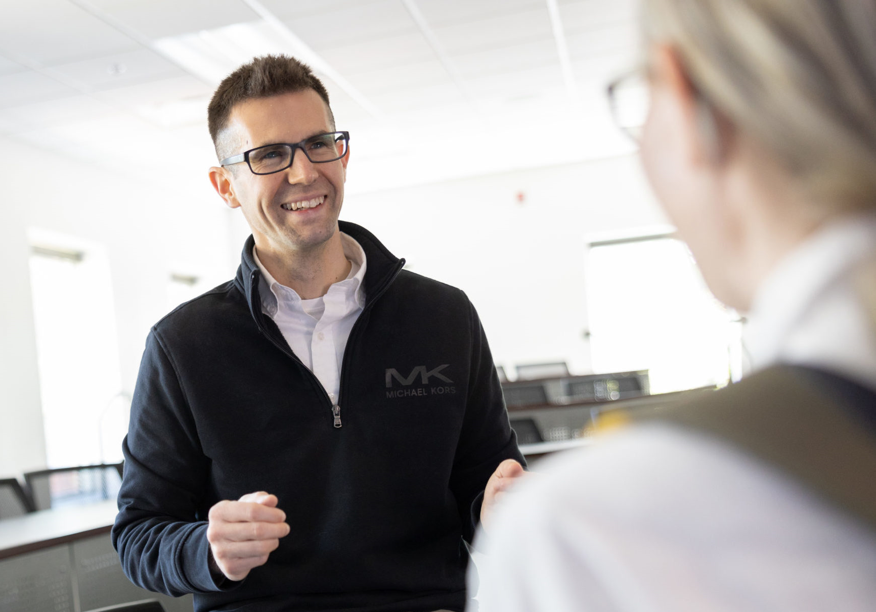 Two individuals conversing