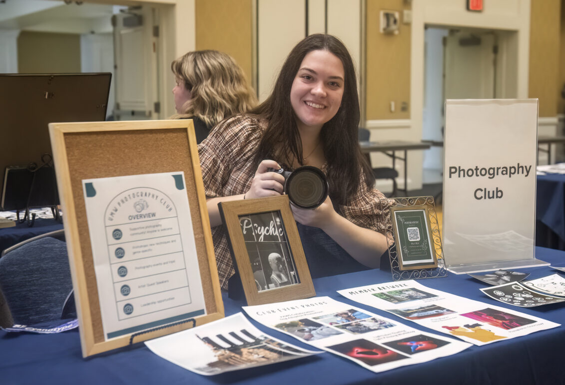 Student representing the Photography Club.