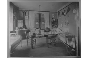 Originally intended for two students, dorm rooms at Willard Hall soon housed three thanks to soaring enrollment. Rooms were equipped with a sink and iron beds, as shown in this 1915 photo. (Simpson Library Special Collections)