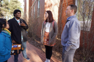 Keith Mellinger (right), dean of Arts and Sciences, talks with Kaitlin Viloria, Rahi Taylor, and Tess Darroch who are attending Akita International University in the fall as exchange students with UMW. Photo by Suzanne Rossi.