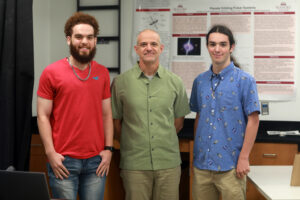 From left to right: UMW senior Jason Walker, Professor of Physics Matthew Fleenor and junior Carter Bussey pose on the fourth floor of Jepson Science Center. Photo by Karen Pearlman.