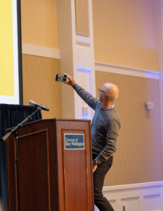 UMW President Troy Paino captures the feeling of the room in a selfie during the employee appreciation luncheon. Photo by Sam Cahill.