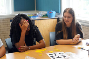 Two Teachers for Tomorrow participants from Prince William County work on a tangram challenge. Photo by Suzanne Carr Rossi.