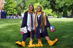 Soon-to-be UMW grads, including Abby Reilly (left) and Bailey McNabb, who often wore the Sammy D. Eagle mascot uniform, pose for photos before UMW's 113th Commencement ceremony. Photo by Suzanne Carr Rossi.