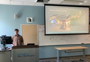 UMW student Eric Hummer presents 'Benevolence or Branding? Understanding the Motivations and Public Reception Behind Major Museum Donations, 1900-2020' during Research and Creativity Day.