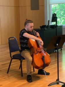 UMW student Parris Dinneen plays cello, an instrument he's only been learning for about a year, during Research and Creativity Day.