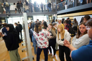 Projects spanned the disciplines and crawled across campus during Research and Creativity Day. Here, students gather in the Hurley Convergence Center's Digital Auditorium to display poster presentations that represent the work they've been doing all semester and beyond. Photo by Suzanne Carr Rossi.