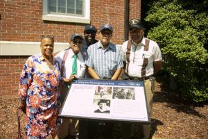 From left to right: Eunice Haigler, John White, James Farmer Multicultural Center Assistant Director Chris Williams, Frank White, Sherman White. The White family was present in honor of their sister, Gladys Jordan White, who was denied acceptance to Mary Washington in 1956. Photo by Karen Pearlman.