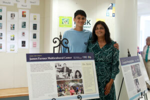 Former James Farmer Multicultural Center Director Ameeta Vashee poses with her son in Combs Hall. Several of the first Black students admitted to Mary Washington studied in Combs, which then housed the sciences. Photo by Karen Pearlman.
