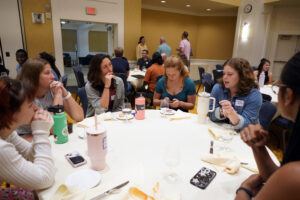 Current students in the Summer Science Institute connect with recent graduate Hannah Harris ’23 at the SSI luncheon, held in the Cedric Rucker University Center's Chandler Ballroom. Photo by Suzanne Carr Rossi.