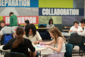 Students work on an art project on the first day of classes at the Academy of Technology and Innovation at UMW. The new lab school, located at Mary Washington's Stafford Campus, welcomed more than 80 students for its inaugural year. Photo by Karen Pearlman.