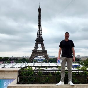 Dickman poses near the Eiffel Tower on the night of the opening ceremony for the Summer Olympics in Paris.