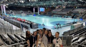 Hadley Mantia '24 poses during training with fellow Allianz bus hosts at the 2024 Summer Olympics in Paris.