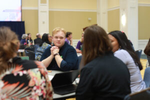 Radford University student Devin Van Dyke participates in an icebreaker at the Virginia Student Voting Summit. Van Dyke drove six hours from his home in Tazewell, Virginia, to attend the summit and speak during a student-panel keynote presentation. Photo by Karen Pearlman.