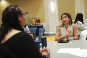 James Madison University senior Ai Vy Le speaks to other Virginia Student Voting Summit attendees during an icebreaker. Le was also part of a student-panel keynote presentation. Photo by Karen Pearlman.