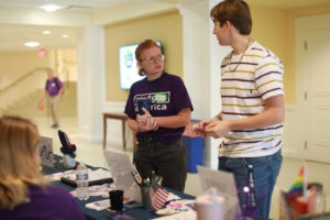 UMW alumna Kate McDaid '23 (left), now regional organizing director for NextGen America, talks to participants at last week's Virginia Student Voting Summit. Photo by Karen Pearlman.