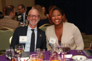 UMW President Troy Paino with Karmel James '13 at the Celebration of Giving in December 2023. Photo by Karen Pearlman.