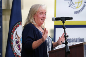 Stafford County School Board member Susan Randall, who also is a member of ATI-UMW's governing board and chair of the ATI-UMW Regional School Board, speaks at the dedication ceremony for the new lab school, now in its inaugural year. Photo by Suzanne Carr Rossi.