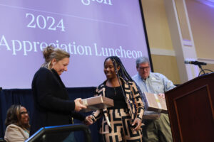 University Galleries Exhibition Coordinator Shannon Petska accepts USC award for her dedication and service. Photo by Karen Pearlman.