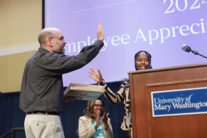 Research and Instruction Librarian Peter Catlin accepts a USC award for his commitment to UMW. Photo by Karen Pearlman.