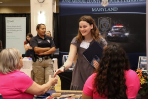 student talks to a prospective employer at the recent Career and Internship Fair, hosted by UMW's Center for Career and Professional Development. Photo by Kaira Otero.