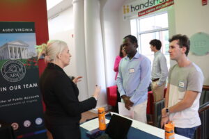 Students speak with a potential employer at the recent Business Career Pathways event hosted by UMW's College of Business. Photo by Killian Petty.