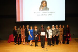 Metzger Award winner Michelle Caldwell Thompson (center) with former award winners. From left to right: Stephanie Lyles, Rose Heyward, Alexandra Dunn, Linda Worrell, Janel Donohue, Susan Spears, Michelle Caldwell Thompson, Dana Herlong, Meta Braymer, Karen Dulaney, Donna Krauss, Mary Katherine Greenlaw and Susan Coleman. Photo by Suzanne Carr Rossi.