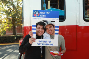 Kaiden and Noah Rojas commemorate their first-ever votes on Election Day. Photo by Karen Pearlman.