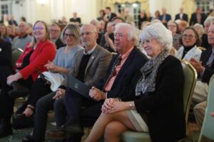 From left: Vice President for Advancement and Alumni Engagement Katie Turcotte, Kelly Paino, President Troy Paino, Distinguished Professor Emeritus Bill Crawley and Dr. Terrie Young Crawley '77 listen as Scott Harris '83 announced the new Great Lives season on Tuesday. Photo by Karen Pearlman.