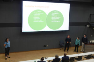 From left to right: UMW business students Tamer Kohn, Jakob Robinette, Natalia Dujka and Tucker Sullivan share their presentation with the judges and a crowd that included business faculty and students, during the College of Business Case Competition. Photo by Karen Pearlman.