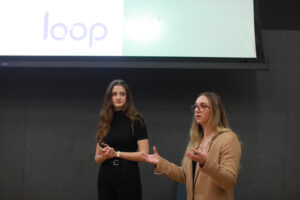 UMW business students Margarita Korsakava (left) and Rachel Nelson answer judges questions during the fall 2024 College of Business Case Competition. Photo by Karen Pearlman.