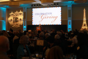 Vice President for Advancement and Alumni Engagement Katie Turcotte quoted late chef and globetrotting TV host Anthony Bourdain as she welcomed donors to the 2024 Celebration of Giving, held in the Cedric Rucker University Center’s Chandler Ballroom. Photo by Karen Pearlman.