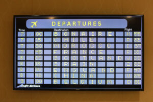 Keeping with the international education theme, ‘Eagle Airlines’ screens outside Chandler Ballroom announced flight arrival and departure times. Photo by Karen Pearlman.