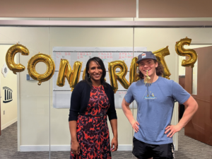 Antoinette Jenkins with UMW student and coloring book illustrator Killian Petty.