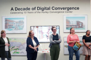 From left to right: Simpson Library employees, Research and Instruction Librarian Elyse Ridder-Roe, Head of Special Collections and University Archives Emeritus Carolyn Parsons, and University Archivist Sarah Appleby join Associate Provost for Institutional Analysis and Effectiveness and Professor of Sociology Debra Schleef and Center for Prevention and Education Director Marissa Miller at the opening reception for 'A Decade of Digital Convergence,' an exhibit celebrating the 10-year anniversary of the Hurley Convergence Center. The exhibit will remain on view in the HCC's Digital Gallery through the end of the fall semester. Photo by Suzanne Carr Rossi.