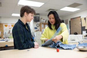 Alicia Austin works with UMW sophomore Kate Rutherford, a Department of Theatre and Dance shop assistant who is majoring in history and classics. Photo by Parker Michels-Boyce.